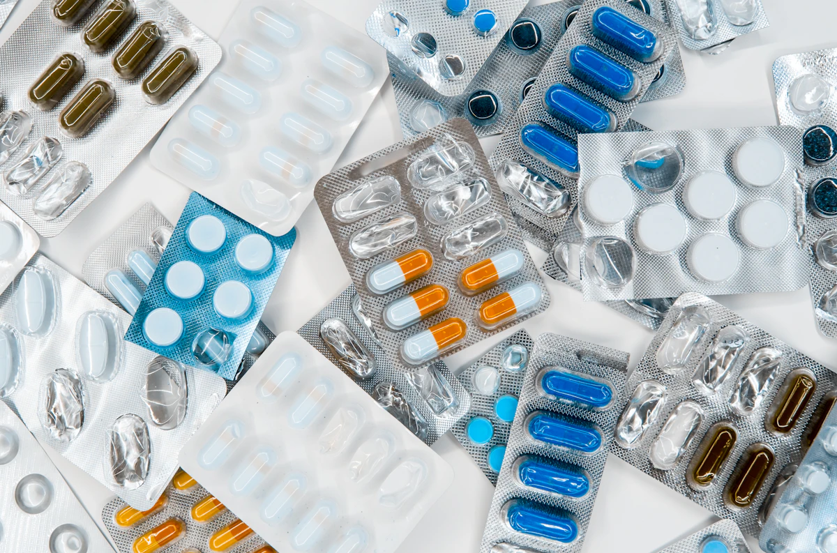 Blister packs of tablets on a pharmacy counter